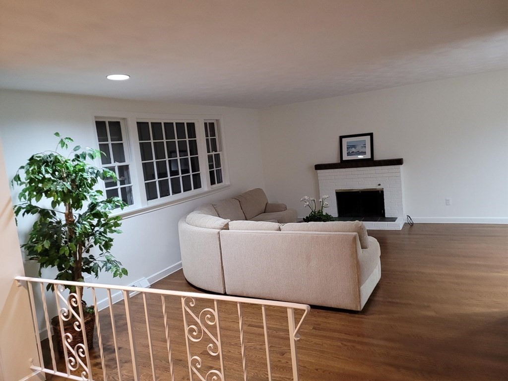 10 Fencourt Road Canton, MA 02021 - Photo 2 of 29 a living room with furniture and a potted plant