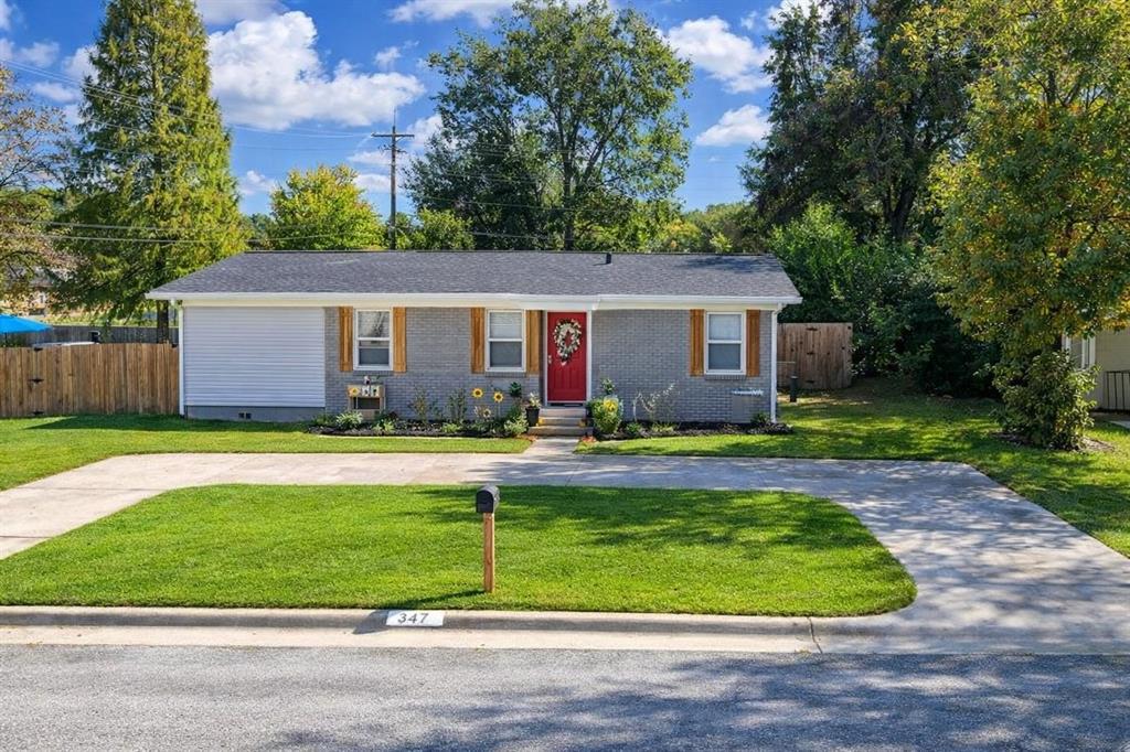 a front view of house with yard and outdoor seating