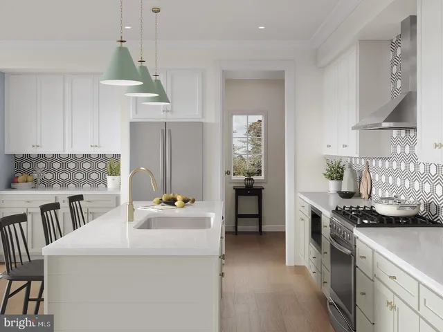 a kitchen with kitchen island a stove a sink and a refrigerator