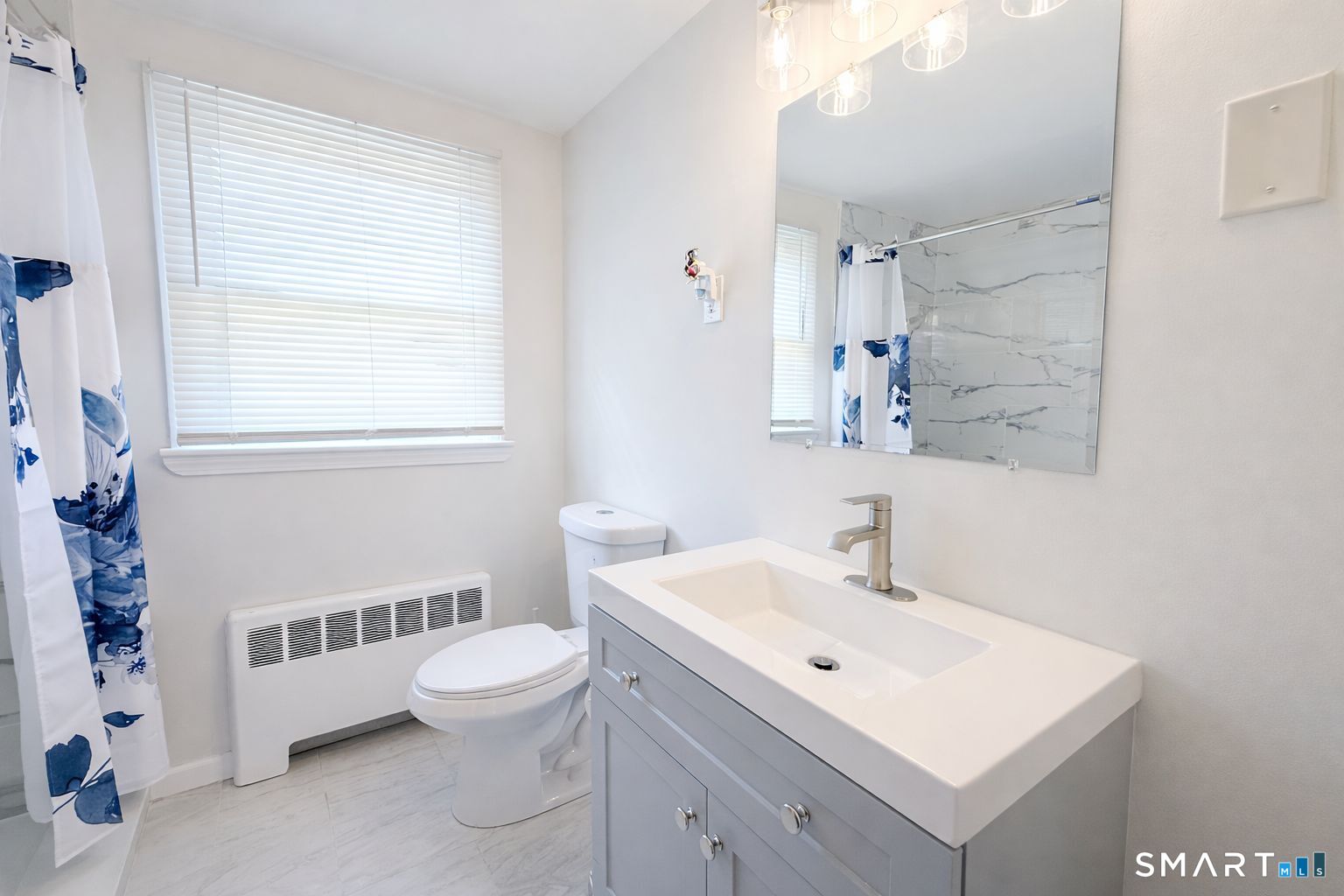 158 Colton Street Windsor, CT 06095 - Photo 7 of 15 a bathroom with a sink a toilet and shower
