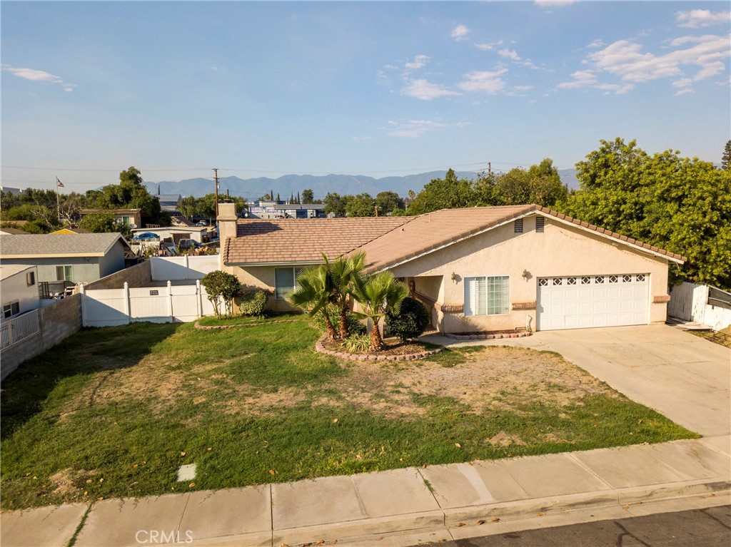456 West Carter Street Rialto, CA 92376 - Photo 1 of 1 a view of a house with a yard