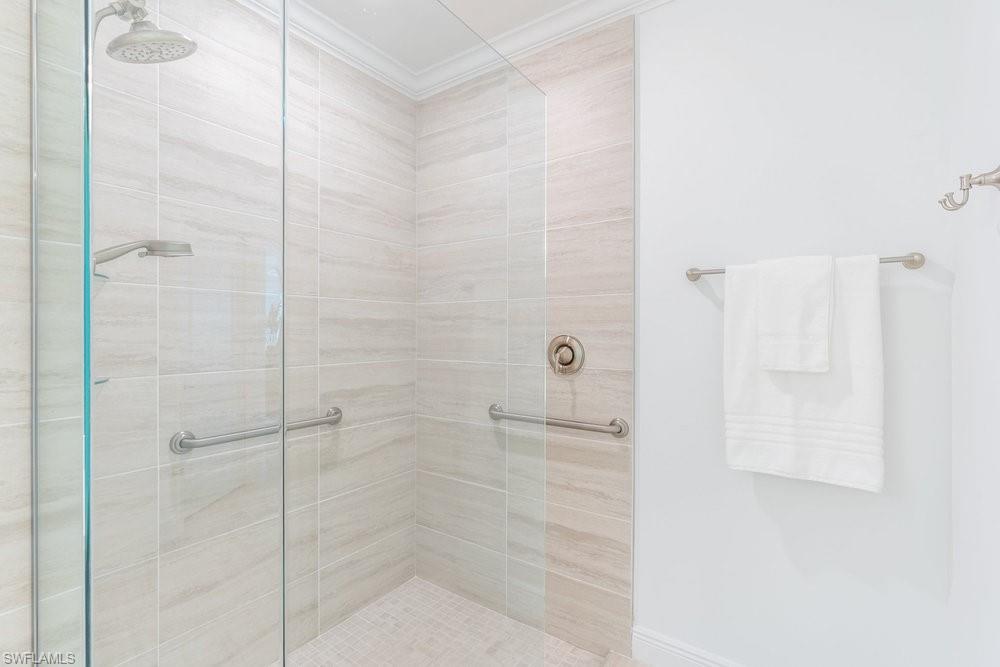 16352 Viansa Way, Unit 10101 Naples, FL 34110 - Photo 16 of 37 a bathroom with a shower