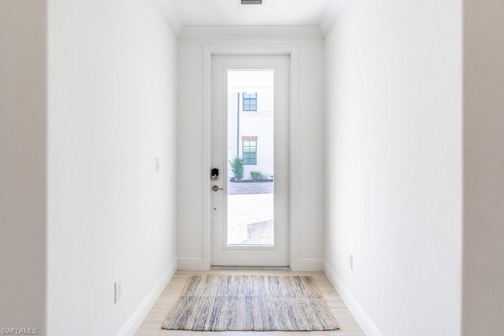 16352 Viansa Way, Unit 10101 Naples, FL 34110 - Photo 2 of 37 a view of a room that has a window in it