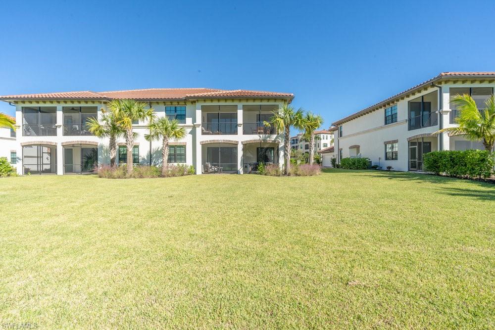 16352 Viansa Way, Unit 10101 Naples, FL 34110 - Photo 28 of 37 a view of a house with a swimming pool