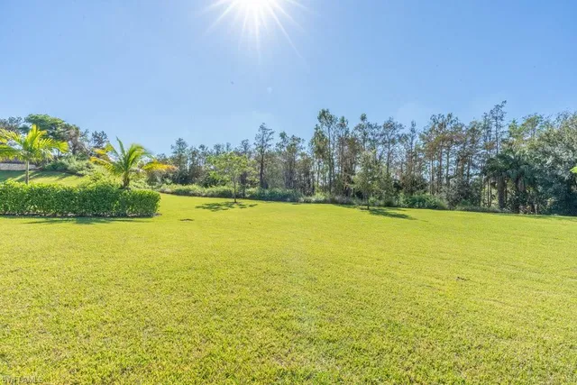 a view of swimming pool with outdoor seating and a patio
