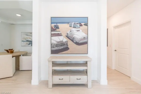 a view of livingroom and bathroom with mirror