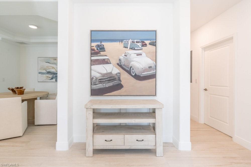 16352 Viansa Way, Unit 10101 Naples, FL 34110 - Photo 3 of 37 a view of livingroom and bathroom with mirror