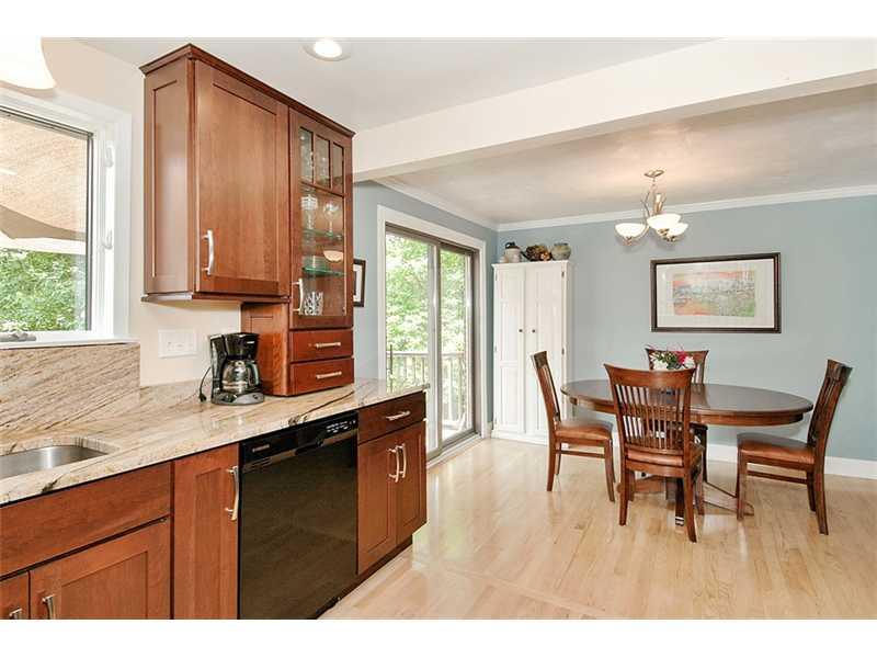 29 Simon Road Cheswick, PA 15024 - Photo 5 of 13 Kitchen. BREAKFAST EATING AREA LEADS TO SLIDER ONTO DECK OVER LOOKING TREED BACKYARD
