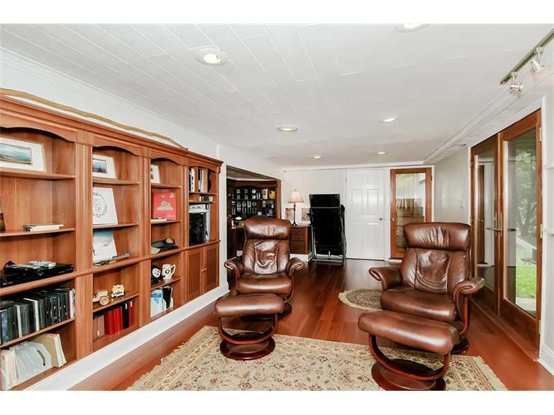 29 Simon Road Cheswick, PA 15024 - Photo 8 of 13 Family Room. ENGINEERED WOOD FLOORS,BUILTIN BOOKCASES,VENTLESS FIREPLACE,FRENCH DOORS TO PATIO,FULL BATH