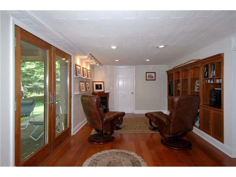29 Simon Road Cheswick, PA 15024 - Photo 10 of 13 Family Room. FRENCH DOORS TO PATIO,RECESSED AND TRACK LIGHTING,VENTLESS FIREPLACE,BUILTINS