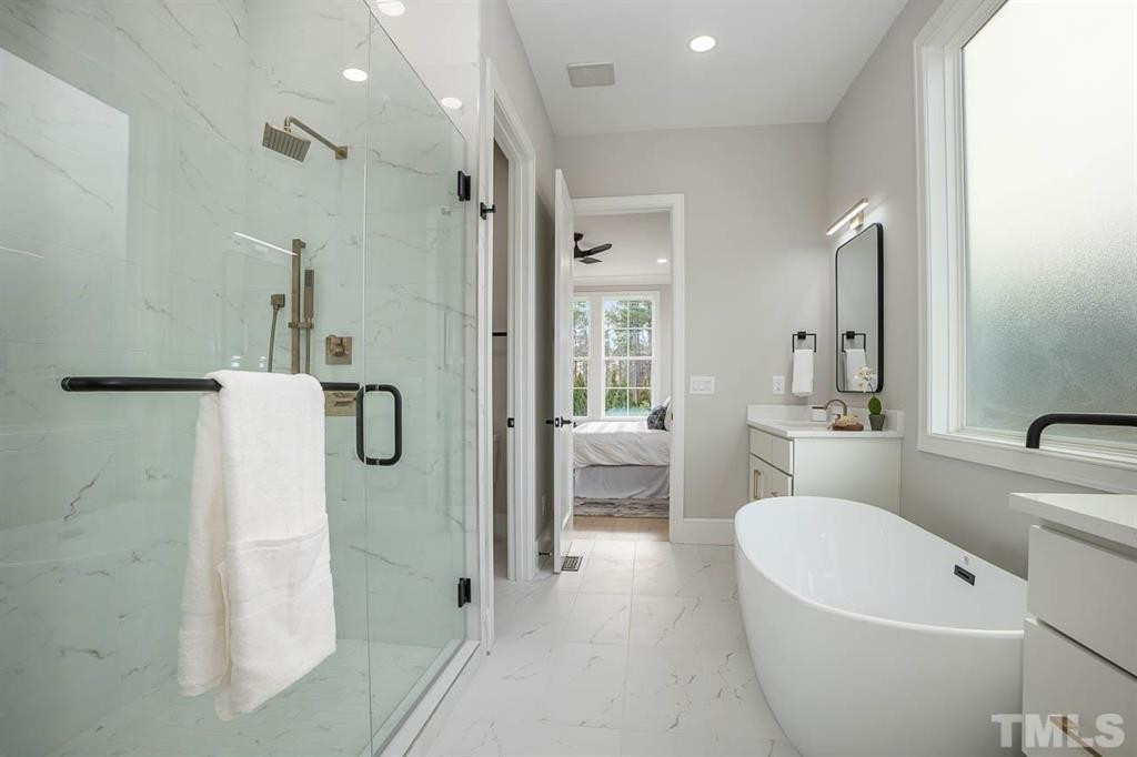 39 Treviso Place Durham, NC 27707 - Photo 11 of 18 a bathroom with a bathtub shower sink and toilet