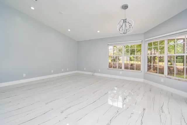 a kitchen with stainless steel appliances a refrigerator sink and microwave