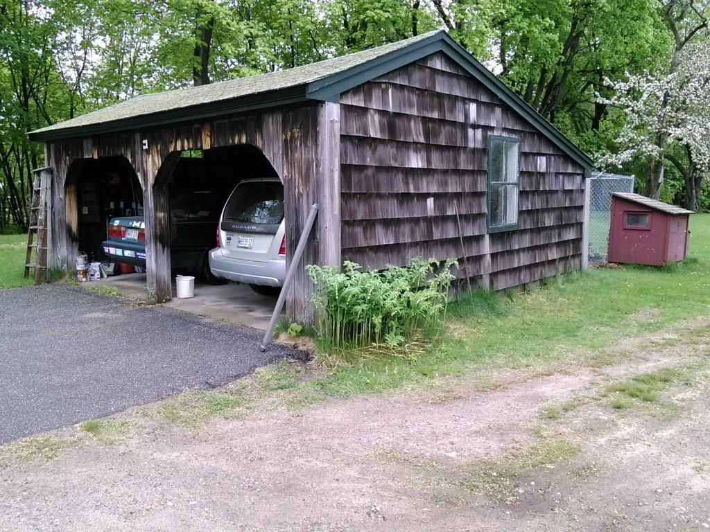 Two car garage with an enclosed pen...