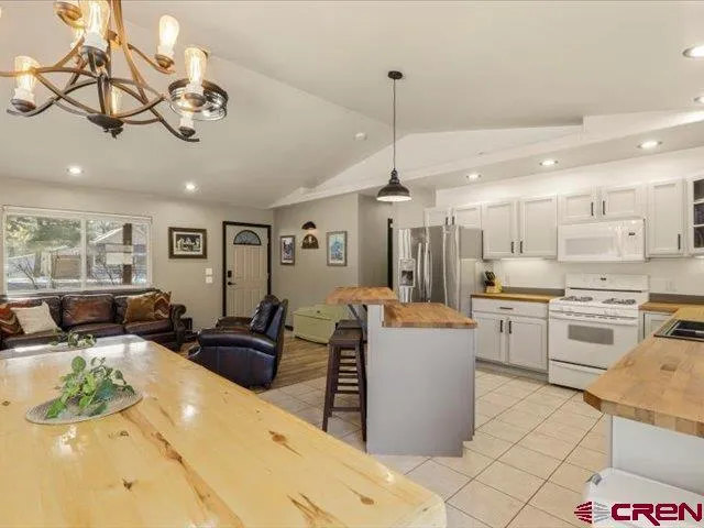 a bathroom with a toilet and shower curtain