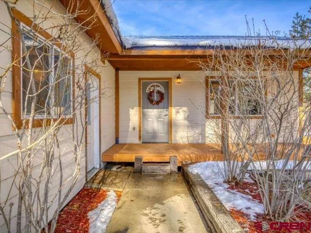 a view of balcony with wooden floor