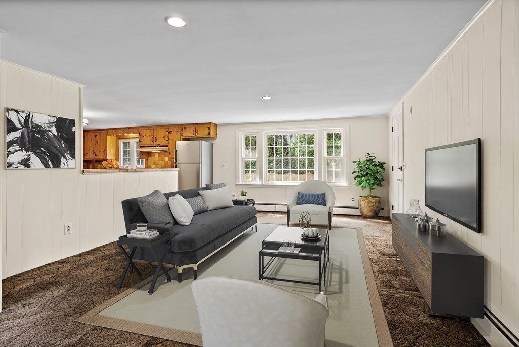 2 Jefferson Drive Acton, MA 01720 - Photo 11 of 38 a living room with furniture and a flat screen tv