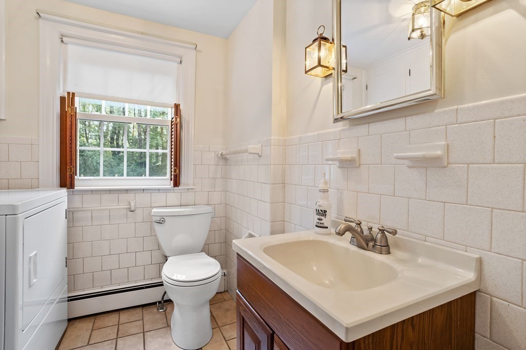 2 Jefferson Drive Acton, MA 01720 - Photo 19 of 38 a bathroom with a sink a toilet and mirror