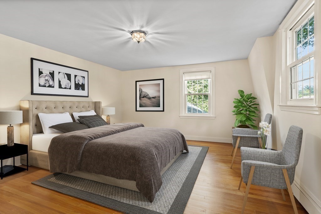 2 Jefferson Drive Acton, MA 01720 - Photo 21 of 38 a spacious bedroom with a bed and a couch