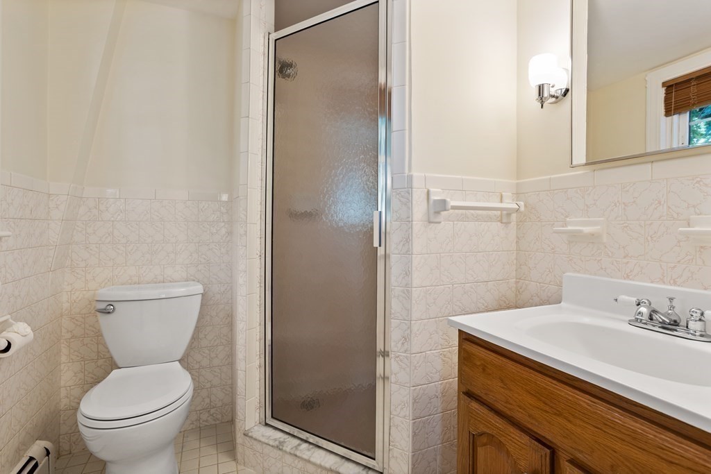 2 Jefferson Drive Acton, MA 01720 - Photo 25 of 38 a bathroom with a toilet sink and shower