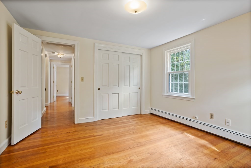 2 Jefferson Drive Acton, MA 01720 - Photo 27 of 38 a view of empty room with wooden floor and fan