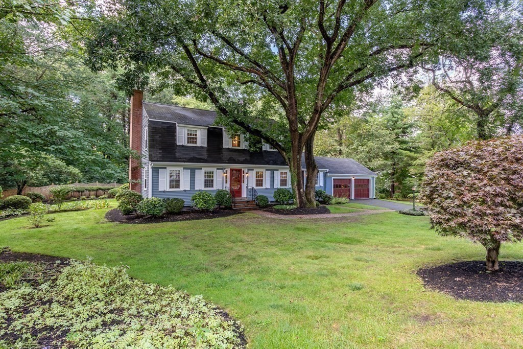 2 Jefferson Drive Acton, MA 01720 - Photo 3 of 38 a view of a yard in front of a brick house with large windows