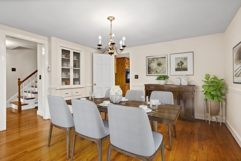 2 Jefferson Drive Acton, MA 01720 - Photo 8 of 38 a view of a dining room with furniture wooden floor and chandelier
