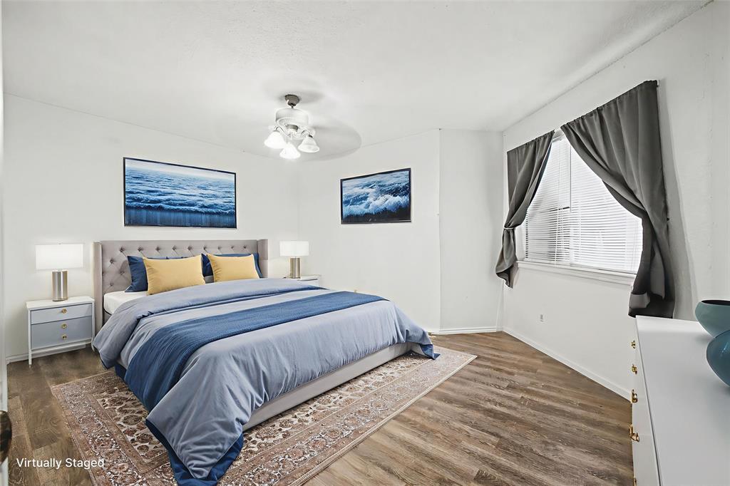 9827 Walnut Street, Unit 210 Dallas, TX 75243 - Photo 25 of 30 a bedroom with bed and a window