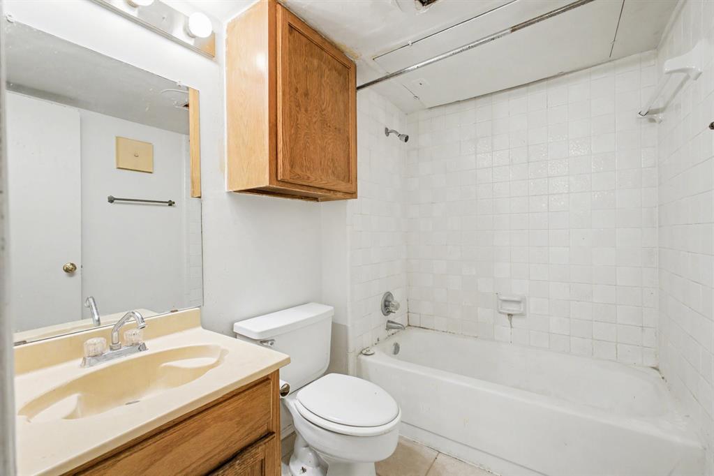 9827 Walnut Street, Unit 210 Dallas, TX 75243 - Photo 28 of 30 a bathroom with a sink toilet and shower