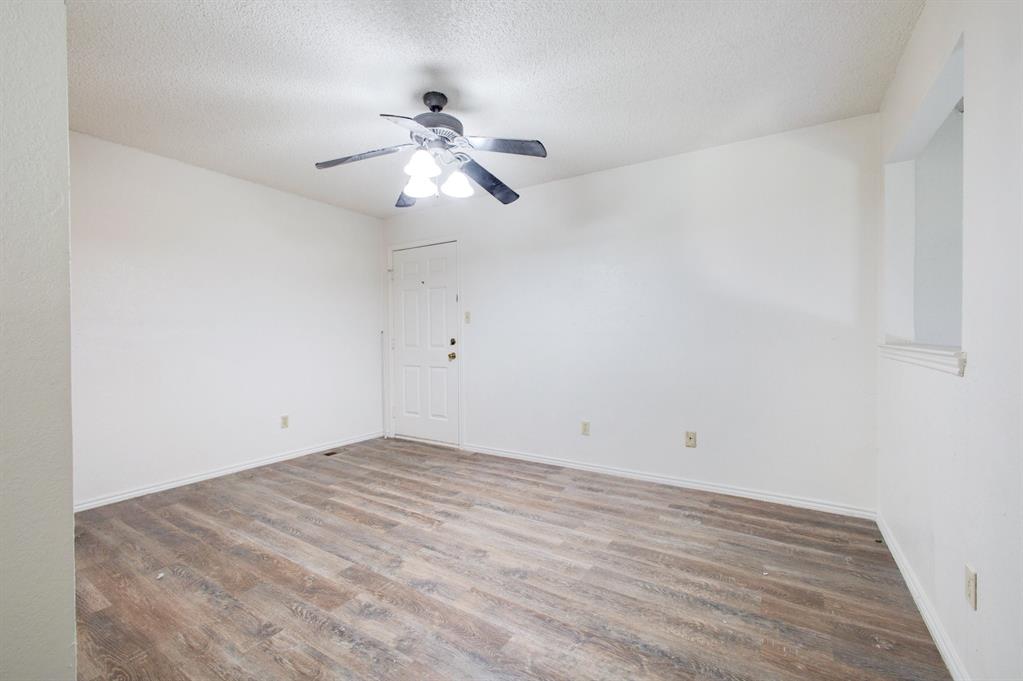 9827 Walnut Street, Unit 210 Dallas, TX 75243 - Photo 7 of 30 a view of empty room with wooden floor