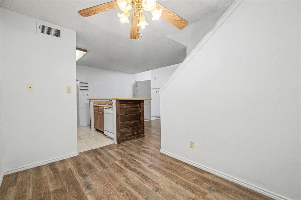 9827 Walnut Street, Unit 210 Dallas, TX 75243 - Photo 10 of 30 a view of empty room with wooden floor