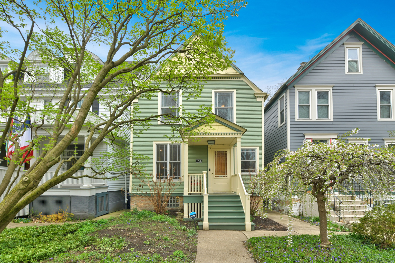 a front view of a house with a garden