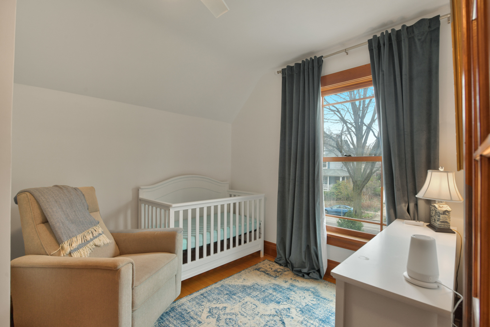 1726 Wesley Avenue Evanston, IL 60201 - Photo 14 of 27 a bedroom with furniture and a window