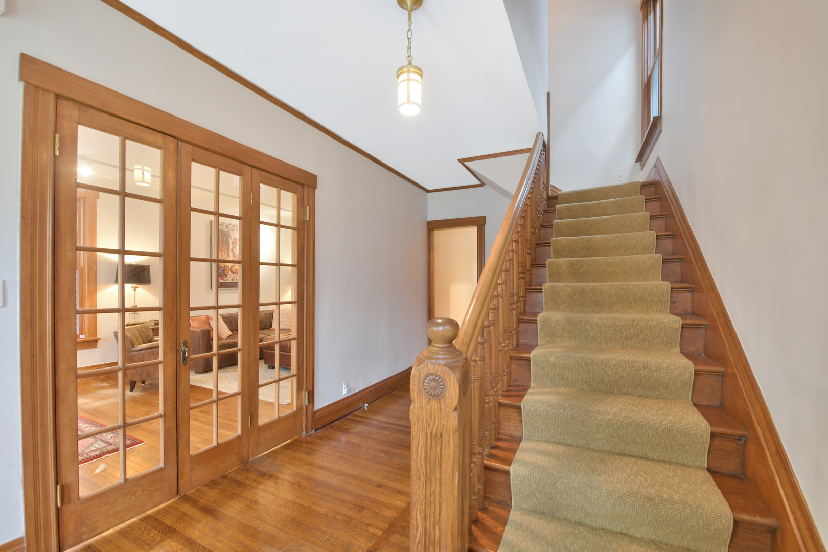 1726 Wesley Avenue Evanston, IL 60201 - Photo 4 of 27 a view of staircase with white walls and windows