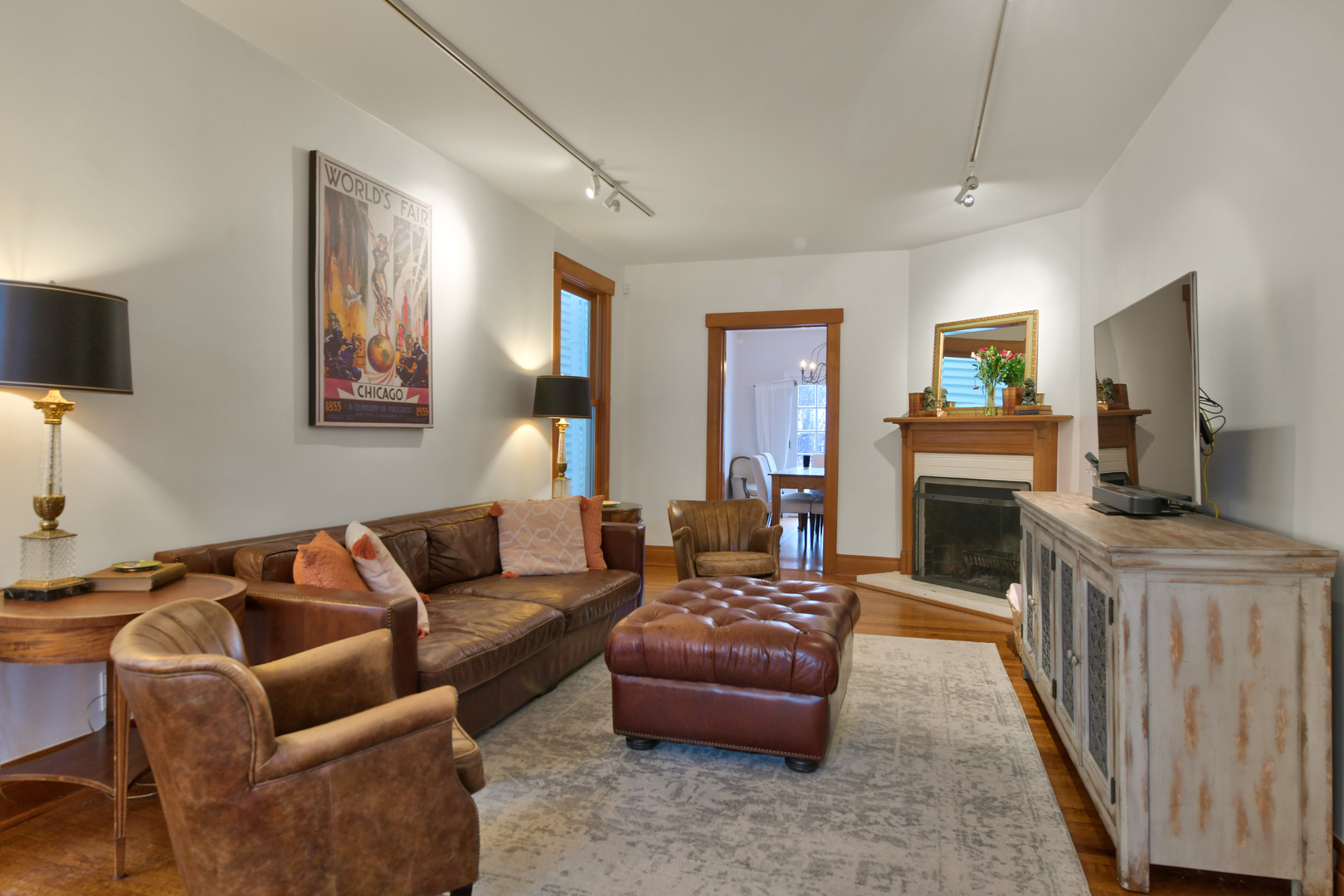 1726 Wesley Avenue Evanston, IL 60201 - Photo 6 of 27 a living room with furniture a flat screen tv and a fireplace
