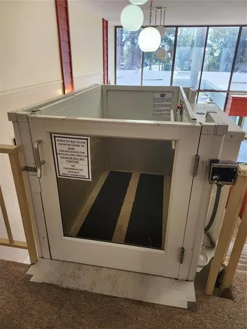 a view of a livingroom with a staircase