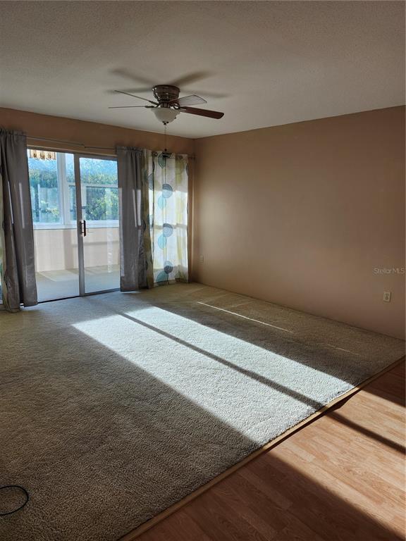 2437 Harbor Boulevard, Unit 213 Port Charlotte, FL 33952 - Photo 4 of 12 a view of an empty room with a window