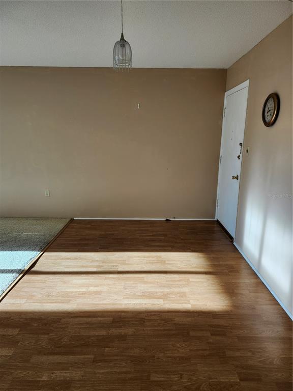 2437 Harbor Boulevard, Unit 213 Port Charlotte, FL 33952 - Photo 6 of 12 a view of wooden floor