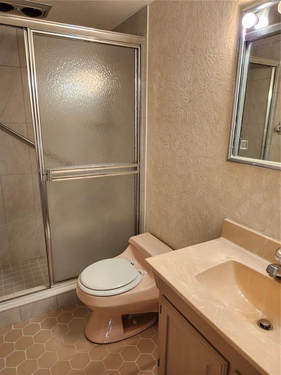 2437 Harbor Boulevard, Unit 213 Port Charlotte, FL 33952 - Photo 10 of 12 a bathroom with a sink and a mirror