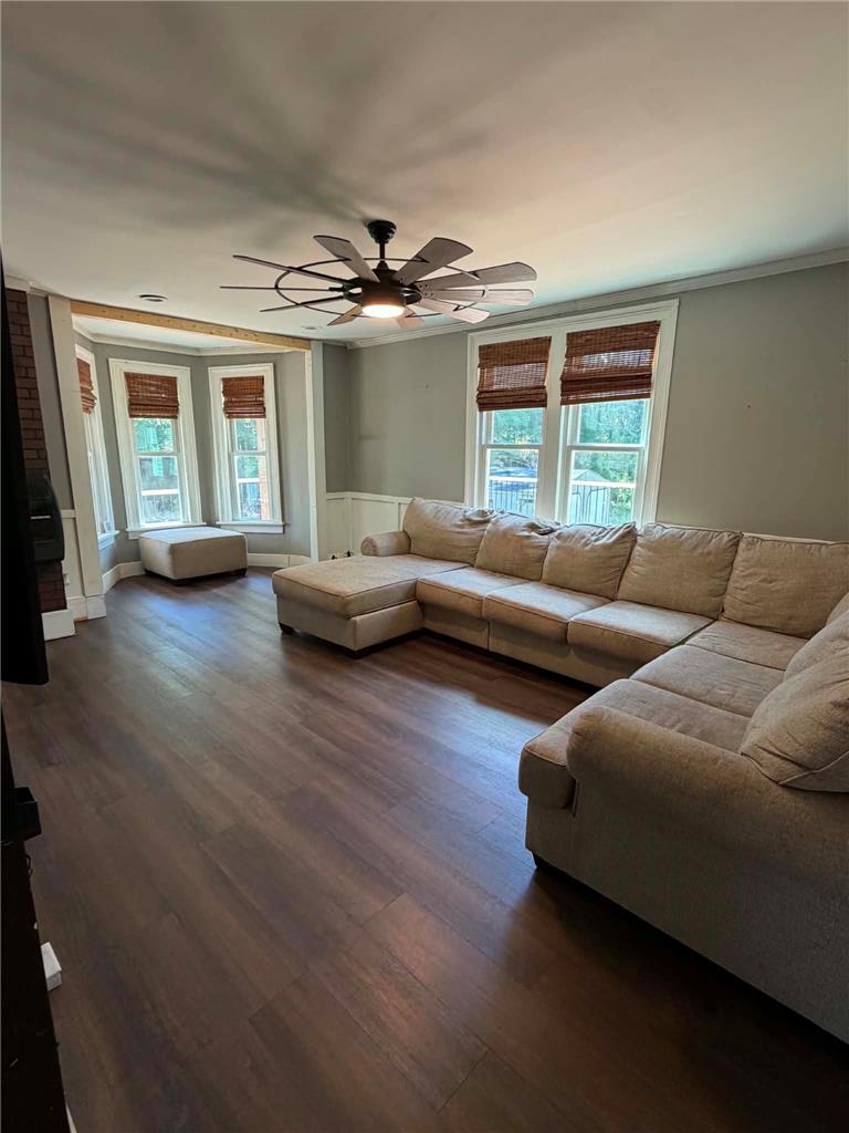 164 Sand Spring Road Cresco, PA 18326 - Photo 36 of 60 Well-lit living room offers ample space for relaxation and stylish dark wood flooring.
