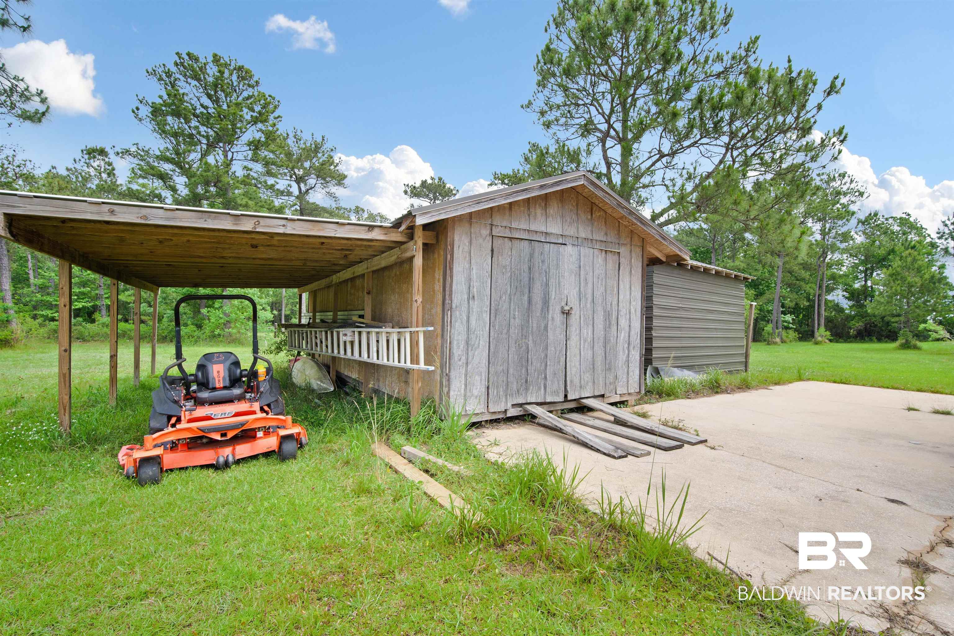 3010 Drag Strip Lane Coden, AL 36523 - Photo 35 of 44 View of outdoor structure featuring a carport and an outbuilding