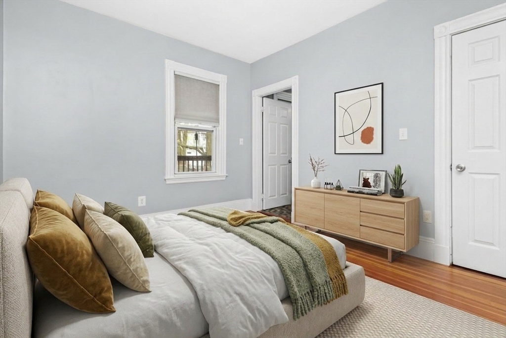 8 Taft Street, Unit 1 Boston, MA 02125 - Photo 14 of 25 a bedroom with a bed and a window