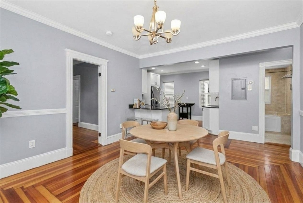 8 Taft Street, Unit 1 Boston, MA 02125 - Photo 16 of 25 a view of a dining room with furniture and wooden floor