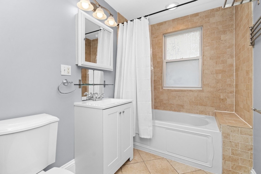 8 Taft Street, Unit 1 Boston, MA 02125 - Photo 17 of 25 a bathroom with a sink a toilet and shower