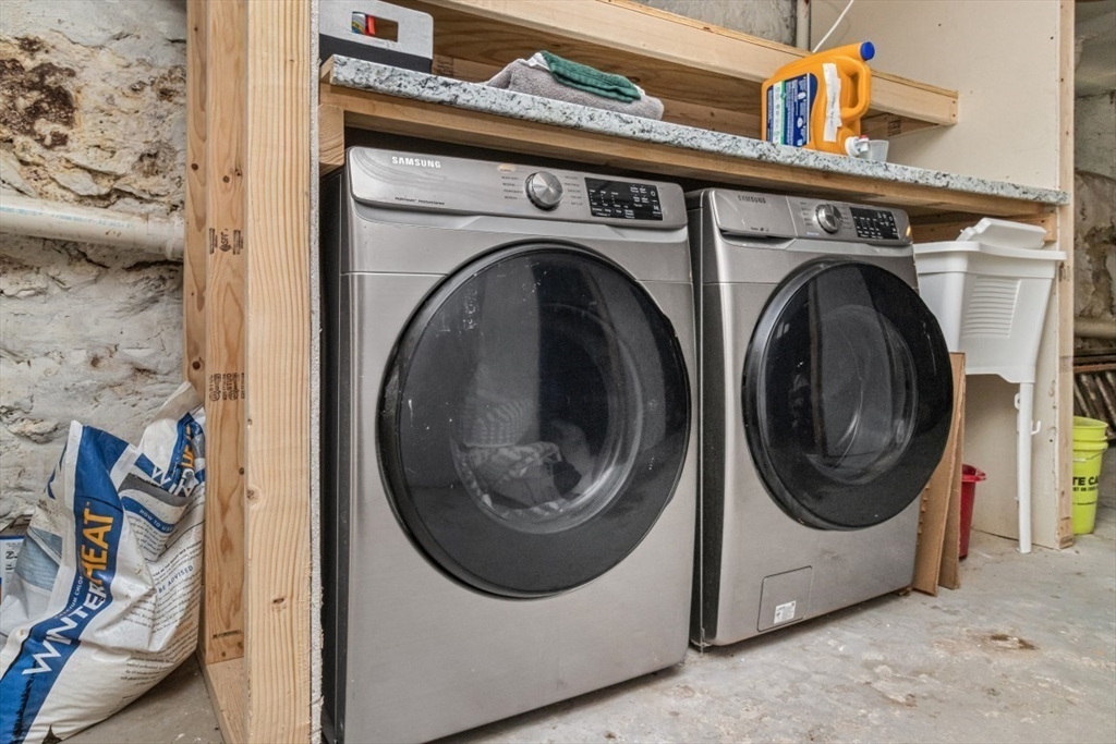 8 Taft Street, Unit 1 Boston, MA 02125 - Photo 24 of 25 a utility room with dryer and washer