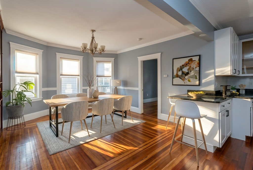 8 Taft Street, Unit 1 Boston, MA 02125 - Photo 6 of 25 a view of a dining room with furniture window and wooden floor
