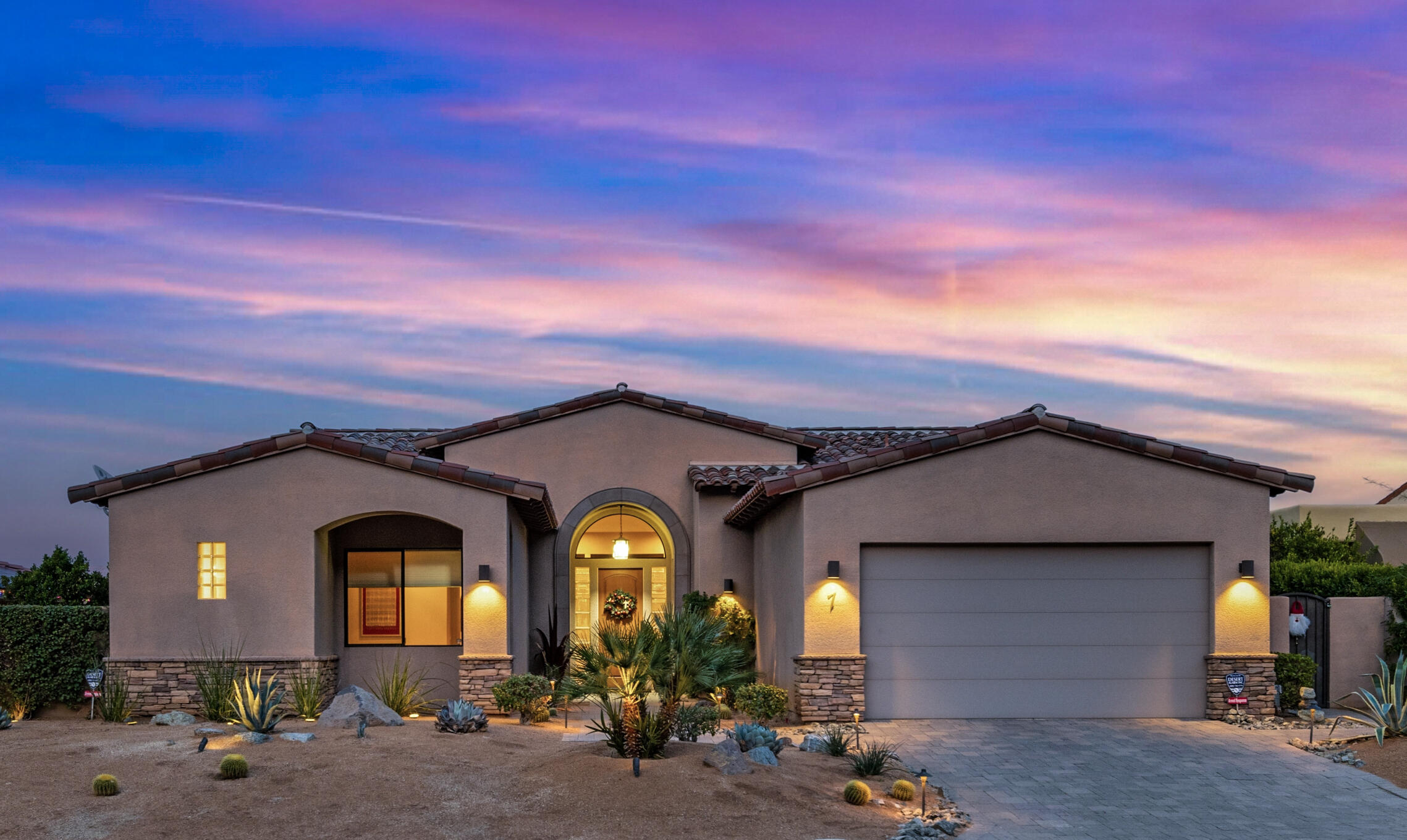 7 Nebulae Way Rancho Mirage, CA 92270 - Photo 1 of 40 a front view of a house with lots of windows and plants