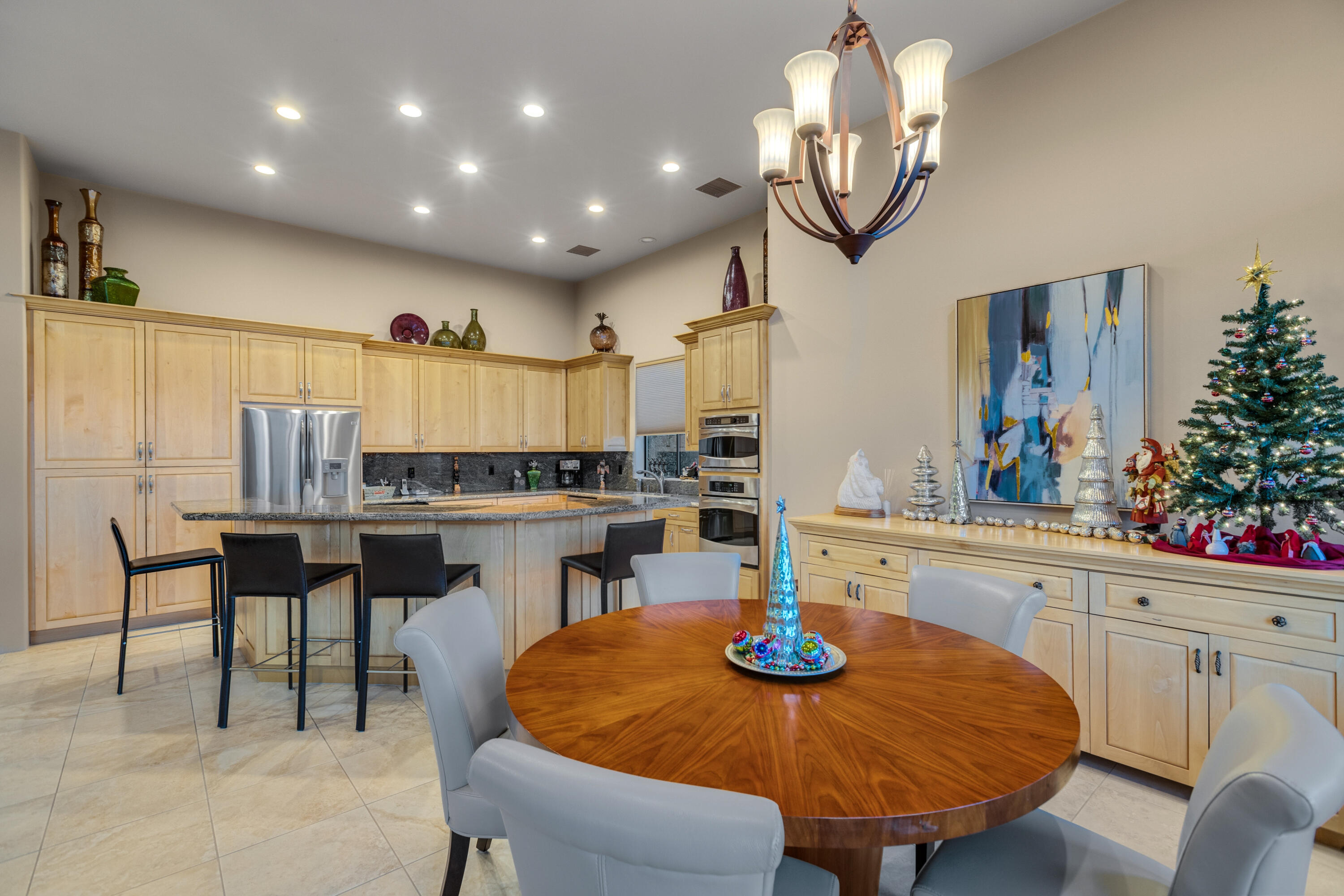 7 Nebulae Way Rancho Mirage, CA 92270 - Photo 13 of 40 a kitchen with a dining table and chairs