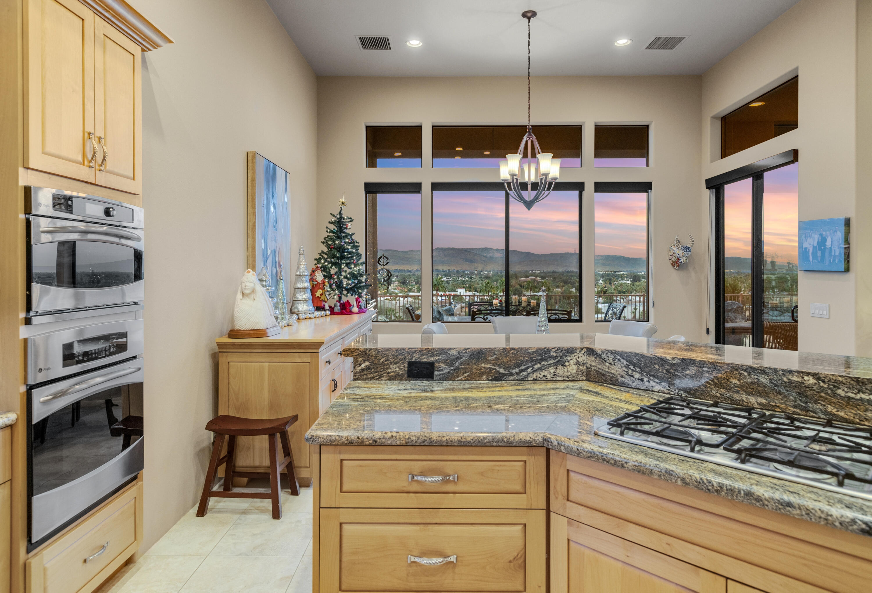 7 Nebulae Way Rancho Mirage, CA 92270 - Photo 17 of 40 a kitchen with a stove and a wooden floor