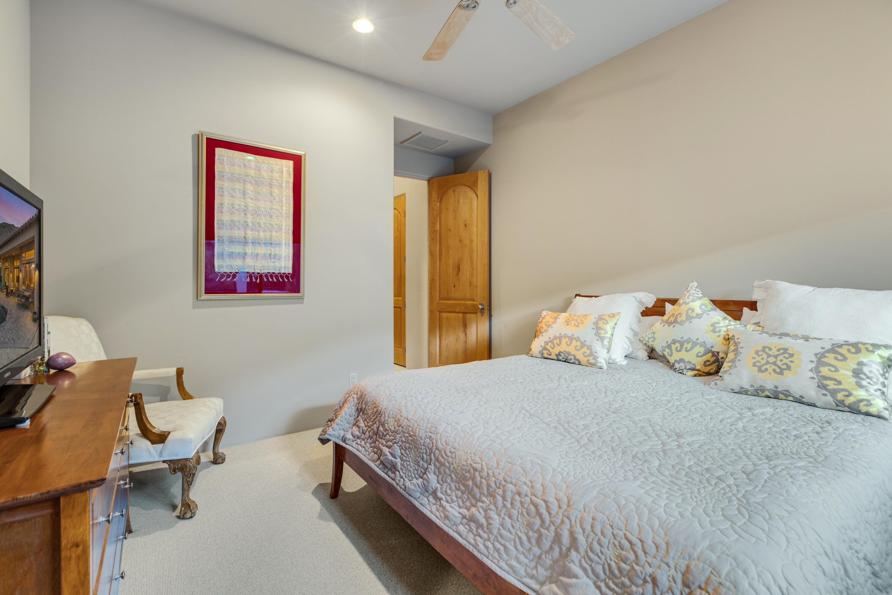 7 Nebulae Way Rancho Mirage, CA 92270 - Photo 19 of 40 a bedroom with a bed and wooden floor