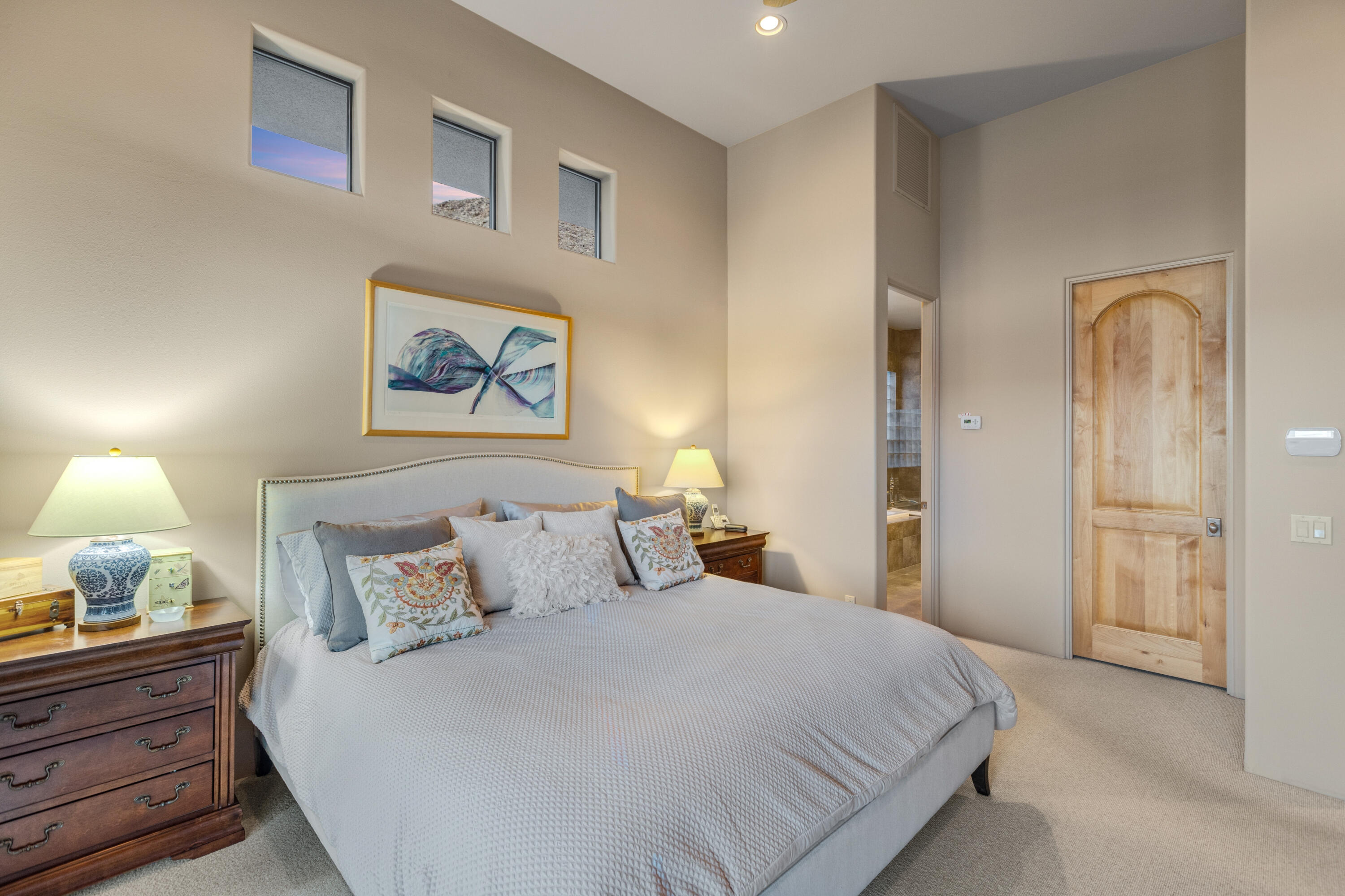 7 Nebulae Way Rancho Mirage, CA 92270 - Photo 24 of 40 a bedroom with bed and paintings on the wall